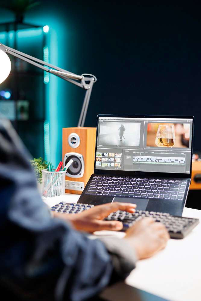 Editing a video timeline on a laptop at a home desk